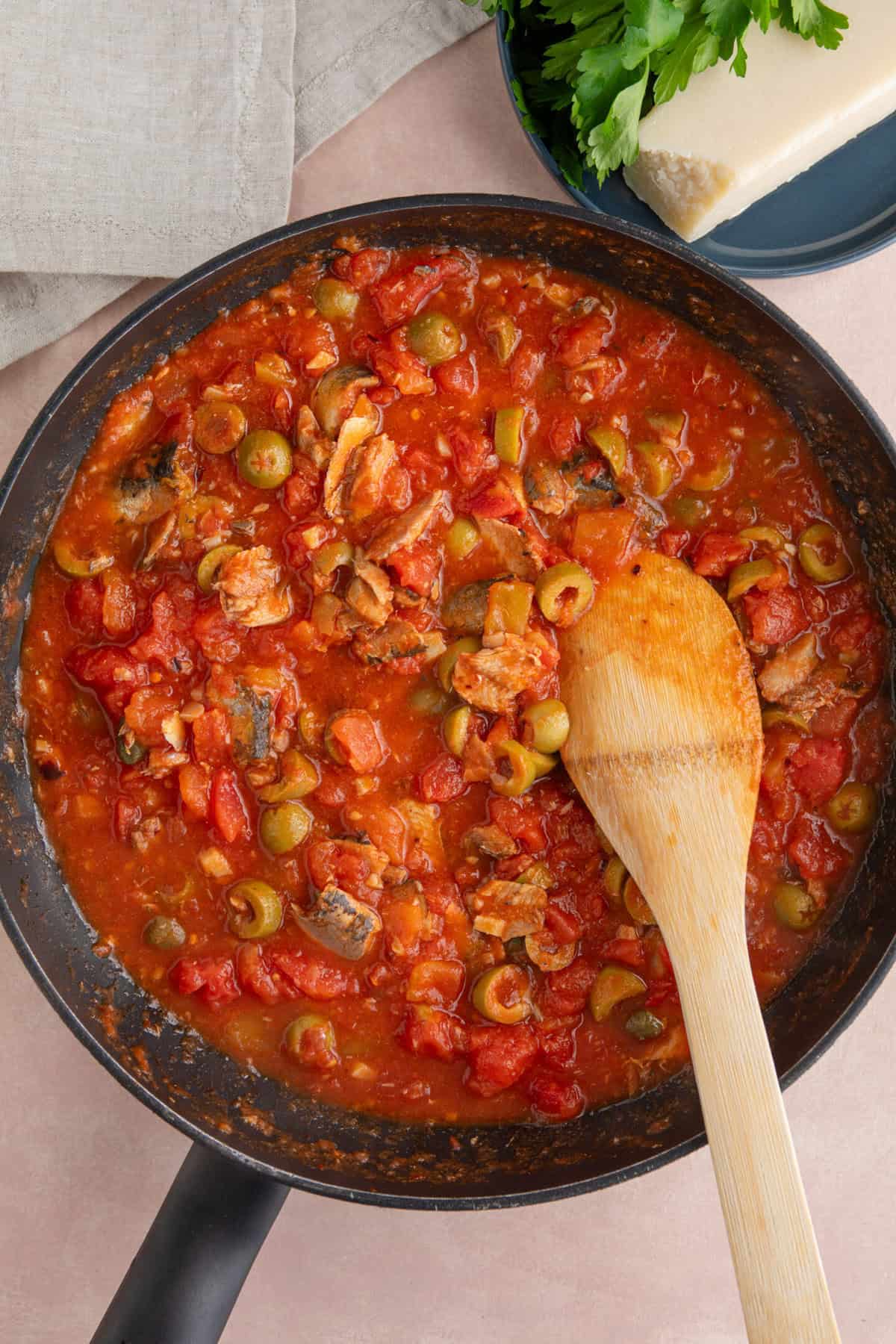 Process shot of sardine pasta recipe showing the sauce cooking in a pan.
