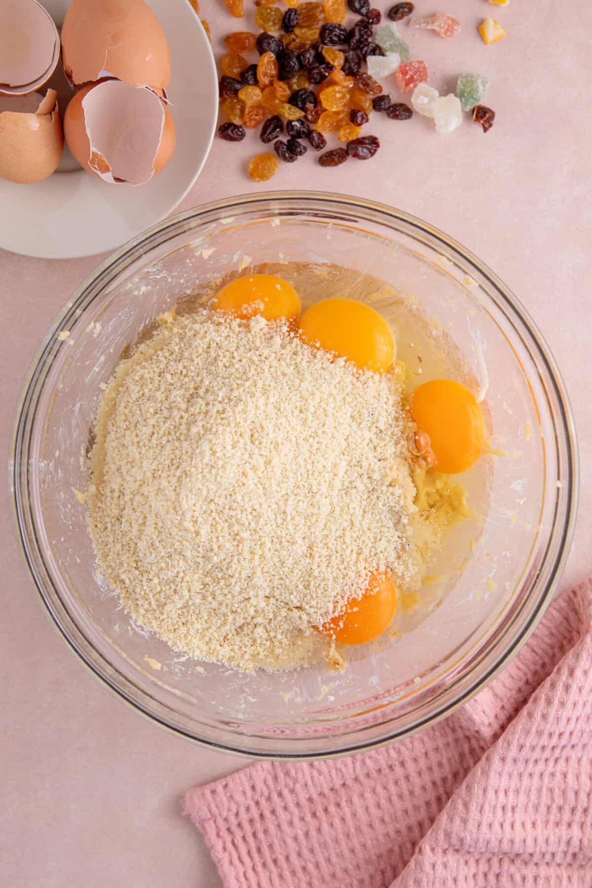 Process shot of a gluten free fruit cake recipe showing all the ingredients in the bowl before mixing.