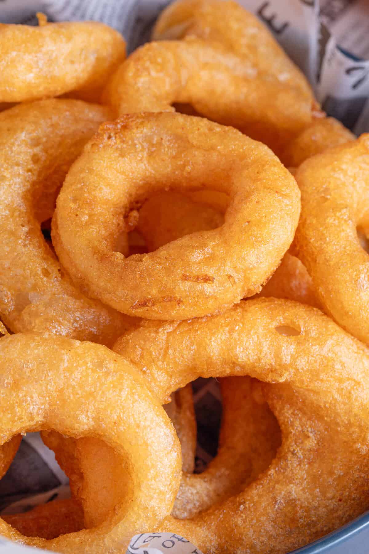 Close up of battered gluten free onion rings.