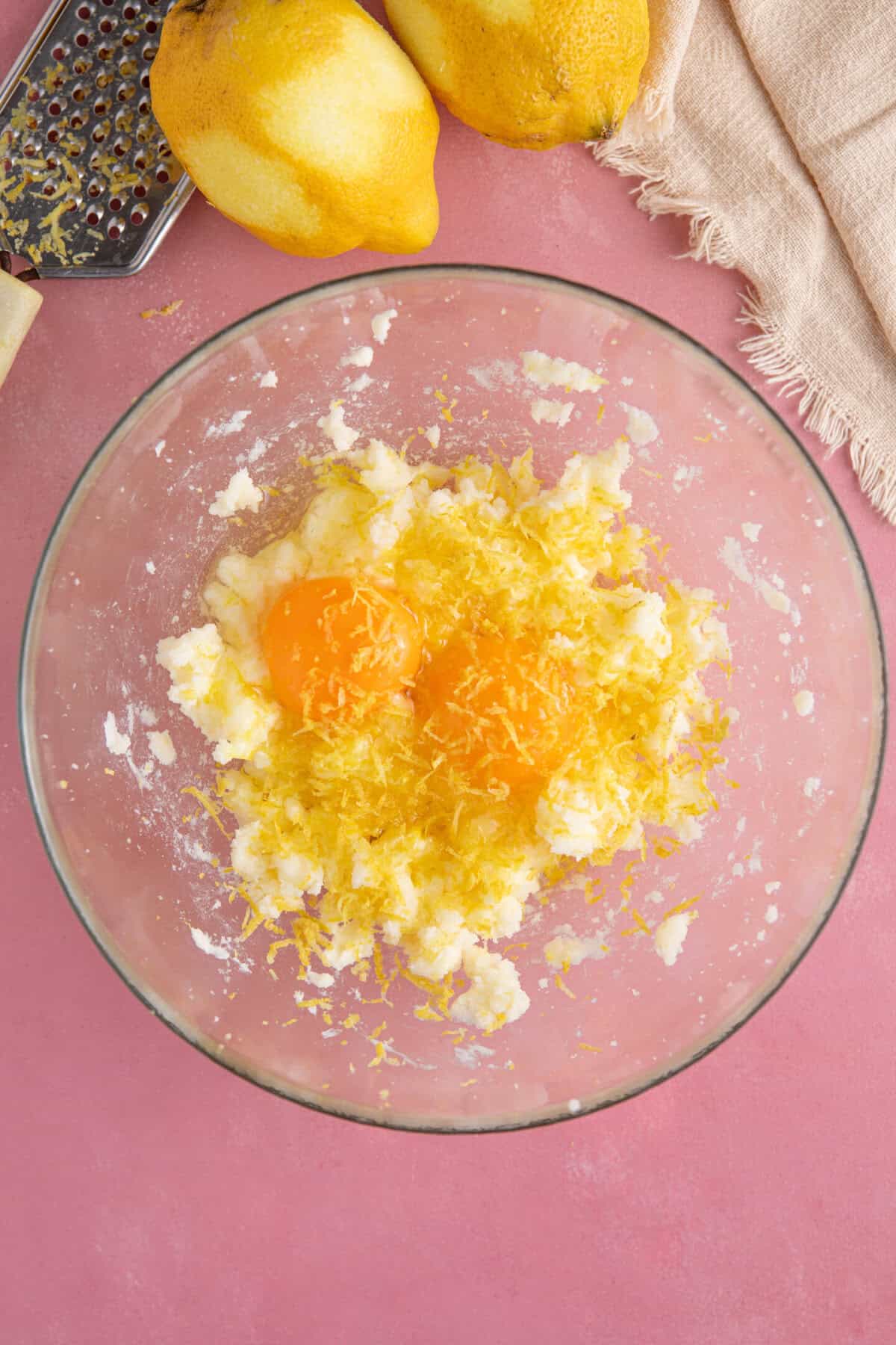Process shot for gluten free lemon drizzle cupcakes showing all the wet ingredients in a bowl.