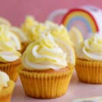 Gluten free lemon cupcakes in yellow cake cases with a swirl of yellow and white buttercream.