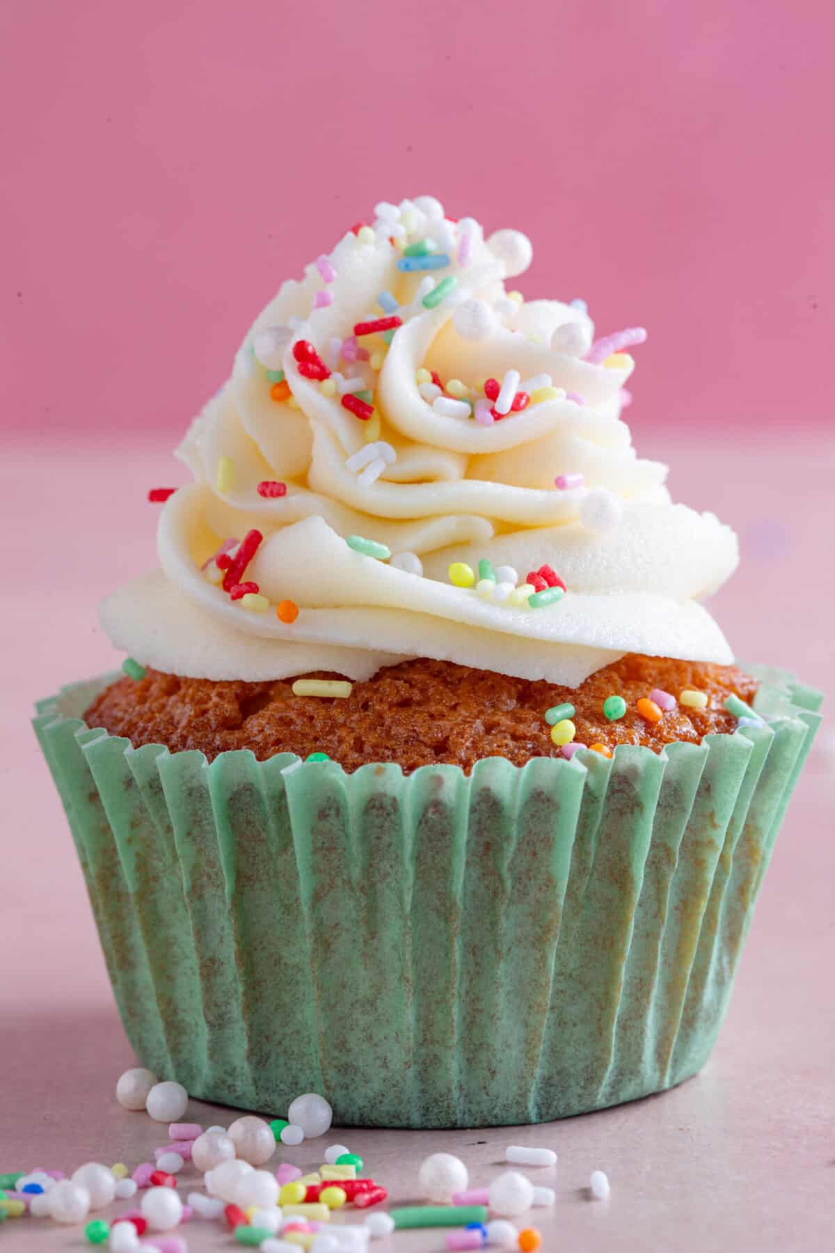 Process shot of gluten free vanilla cupcakes showing the finished cupcake.