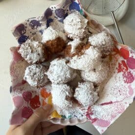 A bowl of gluten free zeppole - small, fried Italian donuts.