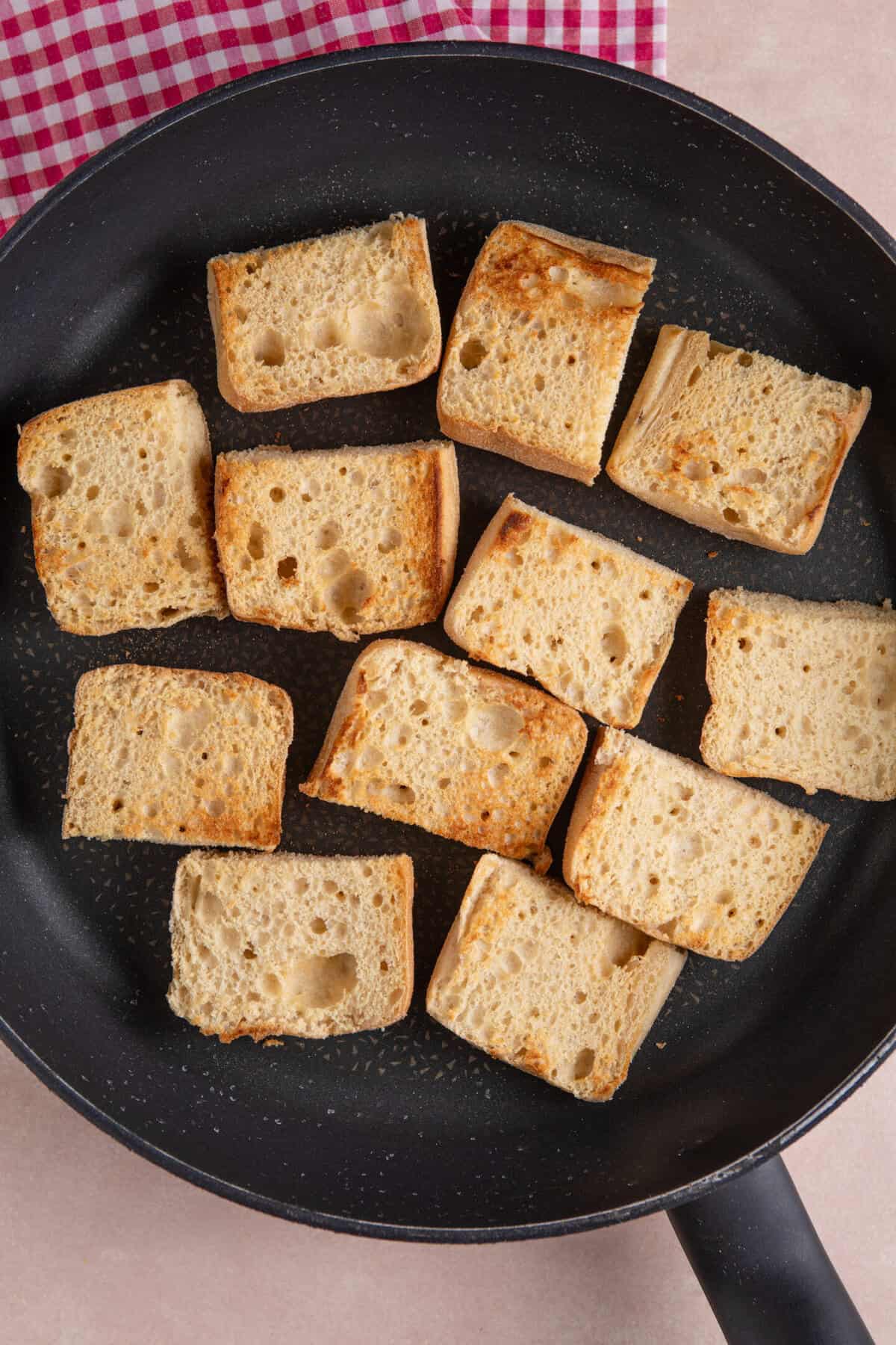 Process shot for gluten free bruschetta showing the slices of ciabatta.