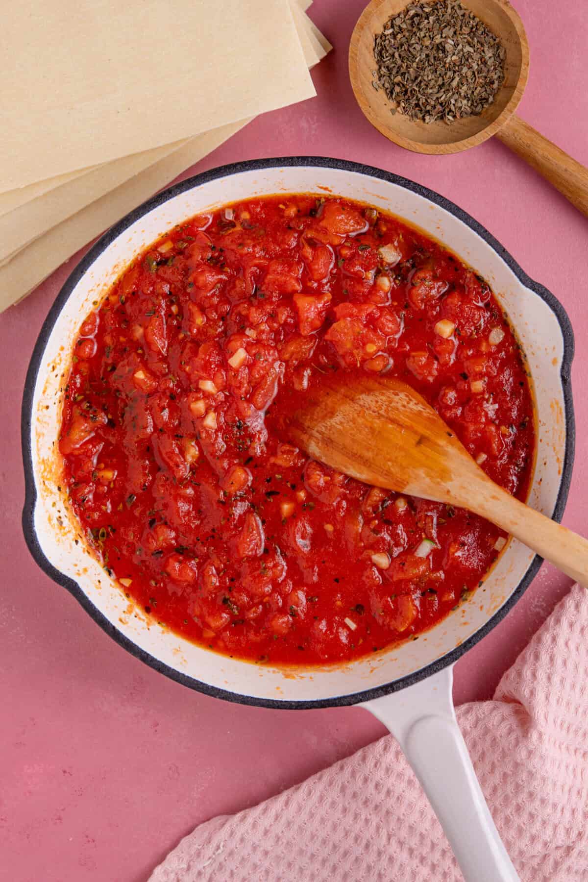 Gluten free courgette lasagne recipe process shot showing making the tomato sauce.