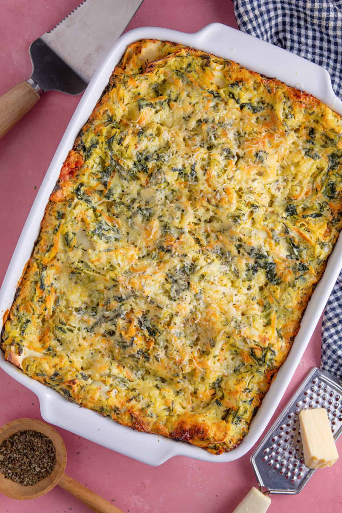 Gluten free courgette lasagne recipe process shot showing the finished lasagne topped with a crispy cheese topping.