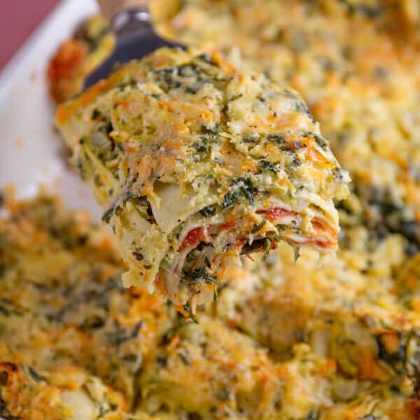 A slice of gluten free courgette lasagne with layers of courgette and ricotta.