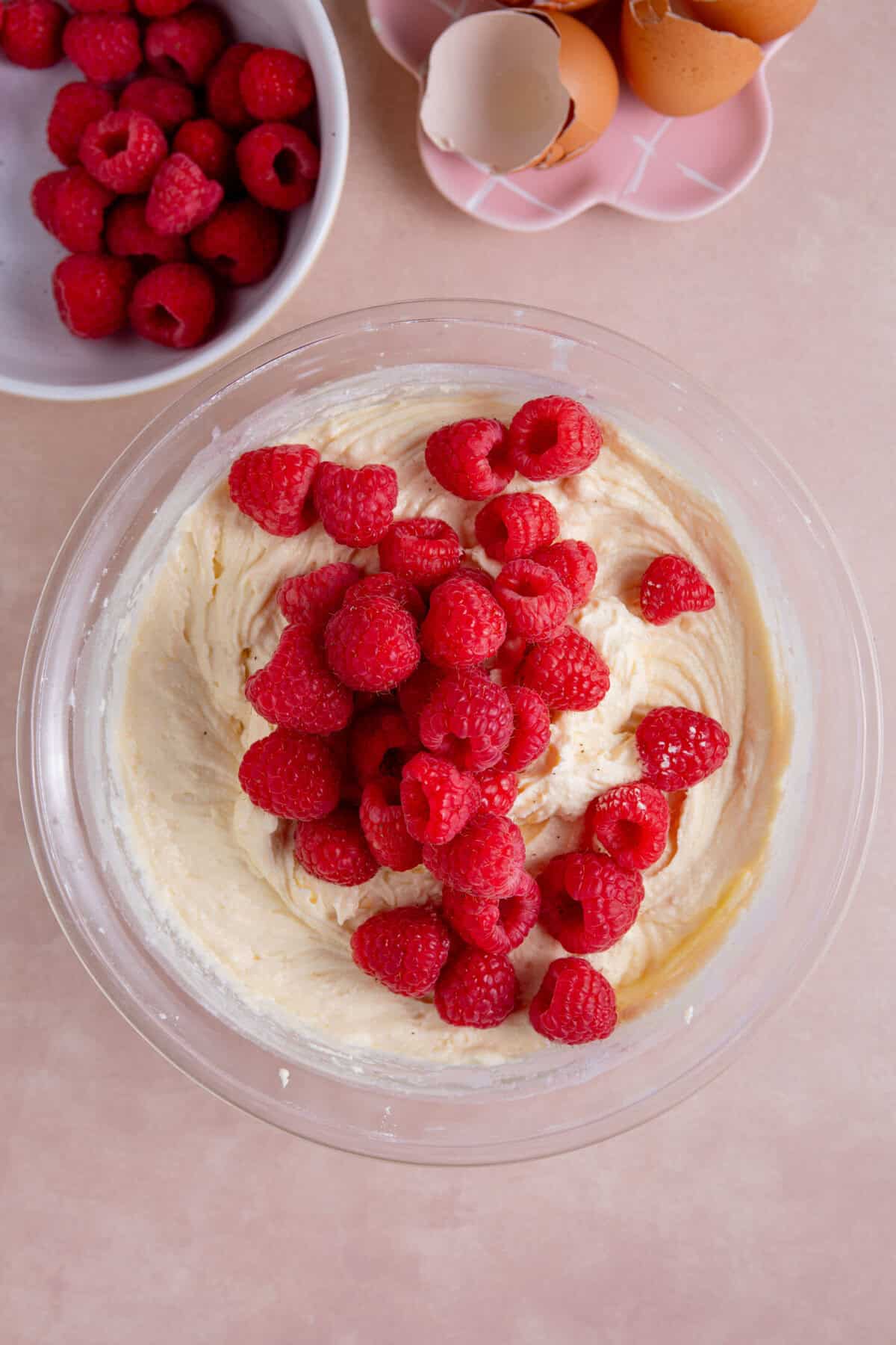 Add the raspberries to the cake batter and fold through gently.