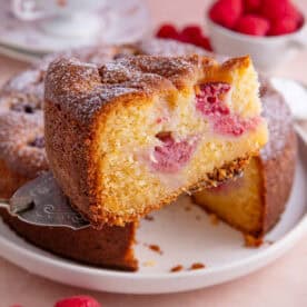 A slice of gluten free raspberry and ricotta cake.