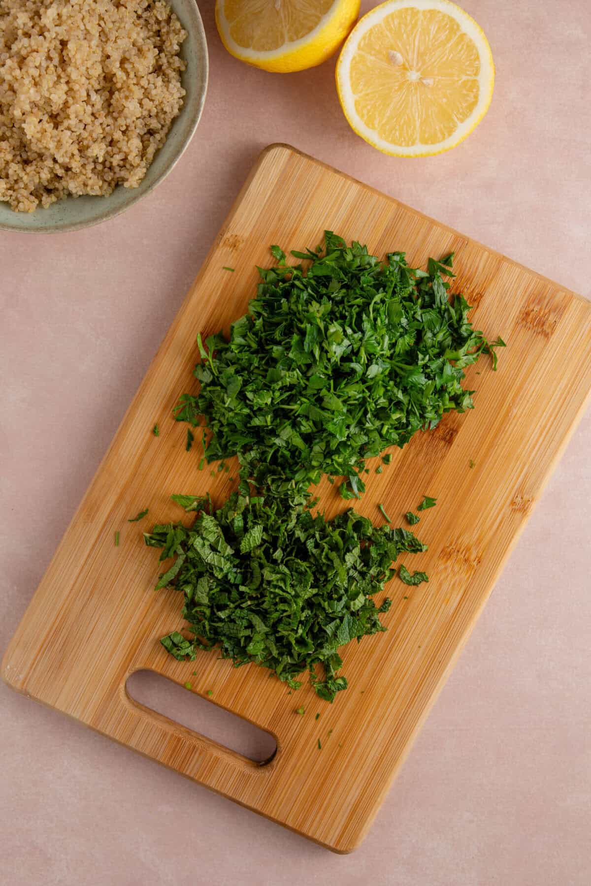 Process shot of gluten free tabbouleh recipe showing the finely chopped parsley and mint.