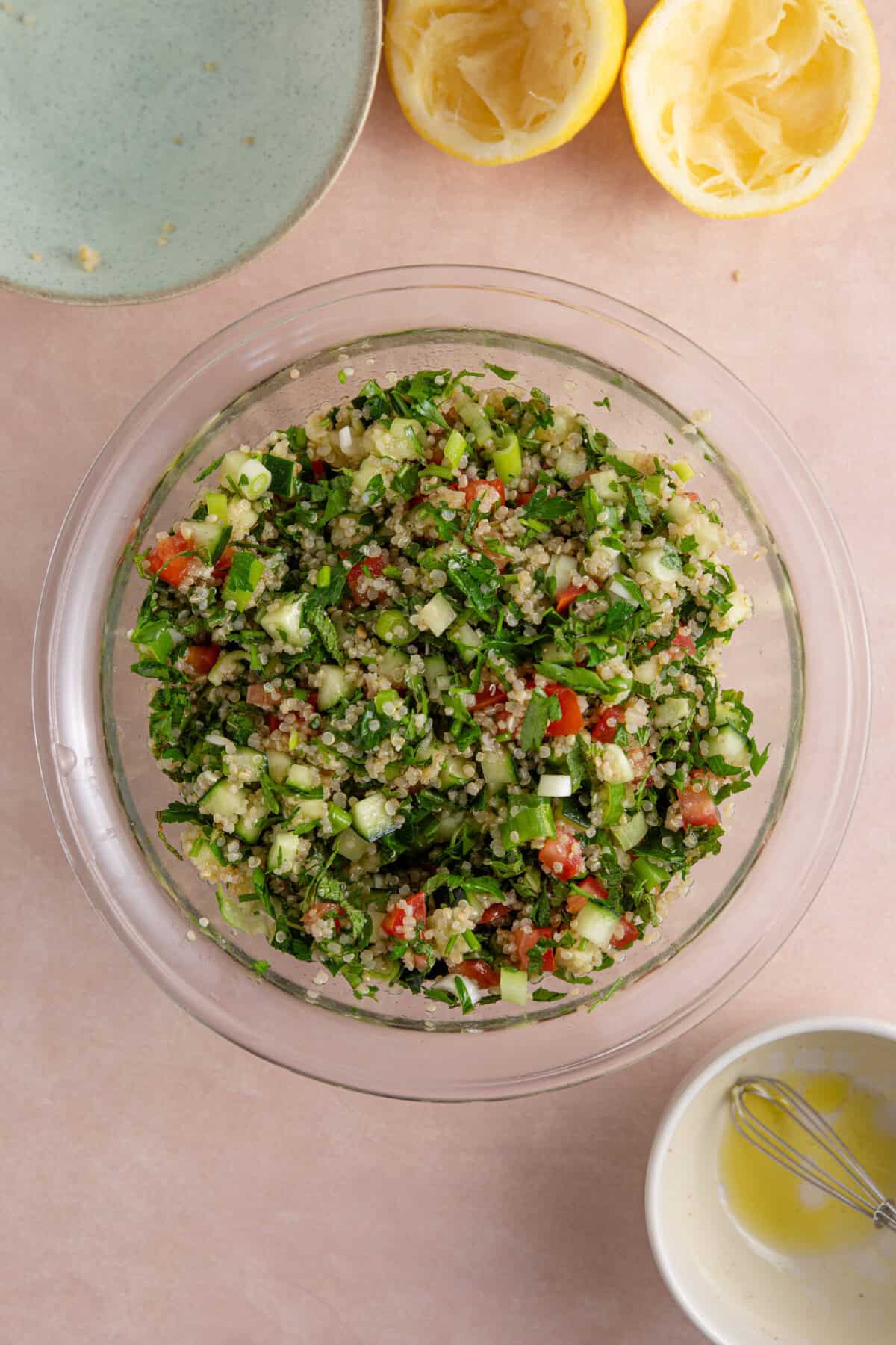 Process shot of gluten free tabbouleh recipe showing everything mixed together in a large bowl.