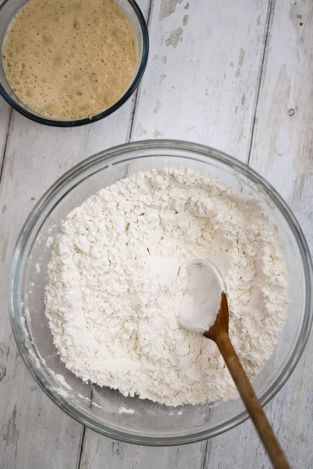 Process shot of 5-ingredient gluten free bread recipe showing the dry ingredients (flour and salt) in a bowl.