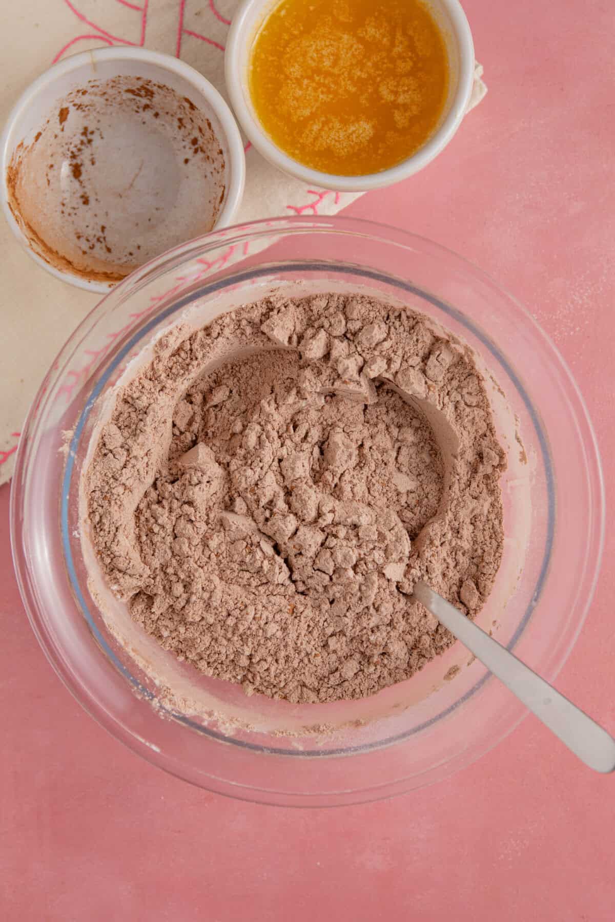 Process shot for gluten free chocolate concrete recipe showing the dry ingredients mixed together in a bowl.