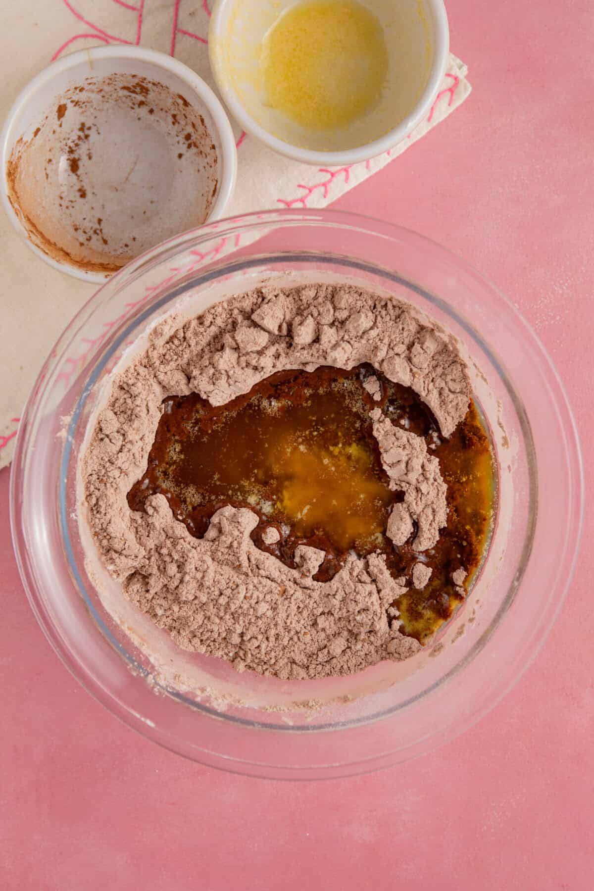 Process shot for gluten free chocolate concrete recipe showing the butter added to the dry ingredients.