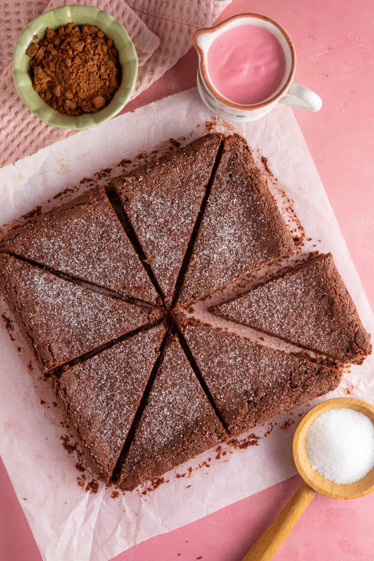 Process shot for gluten free chocolate concrete recipe showing the finished concrete cut into triangles.