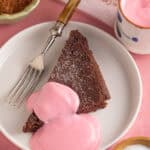 A slice of chocolate concrete with pink custard.