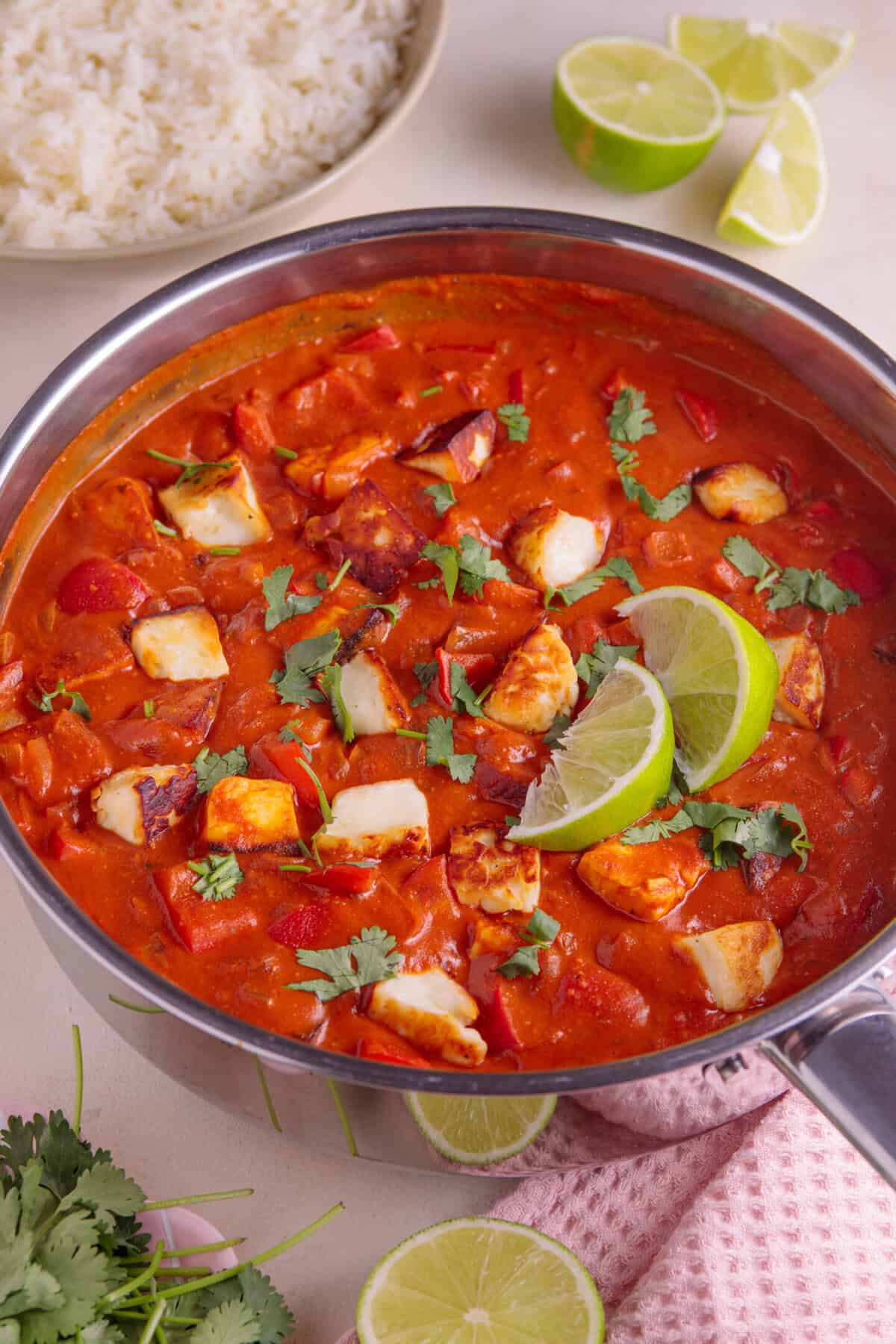 Process shot for halloumi curry showing the finished halloumi curry in a pan.