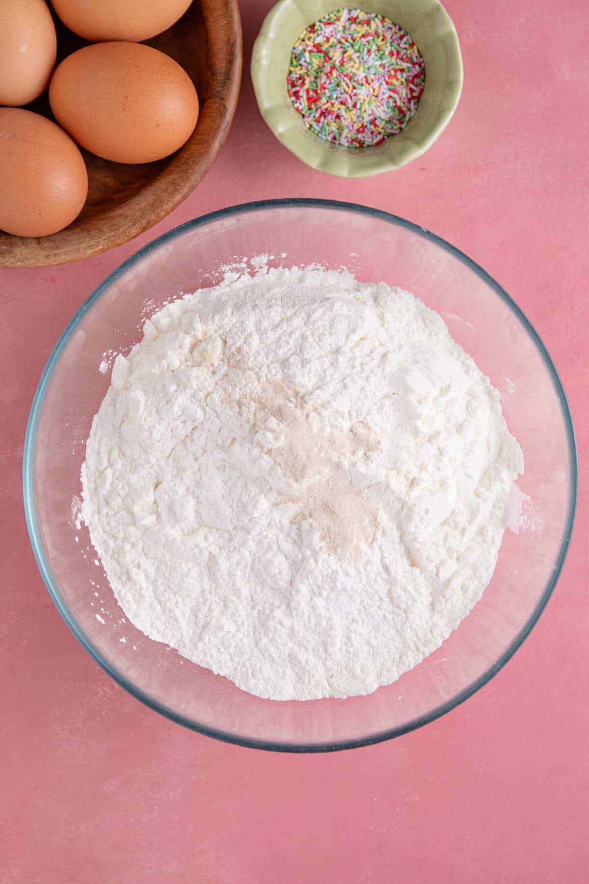 Process shot for gluten free school dinner cake showing the dry ingredients in a mixing bowl.