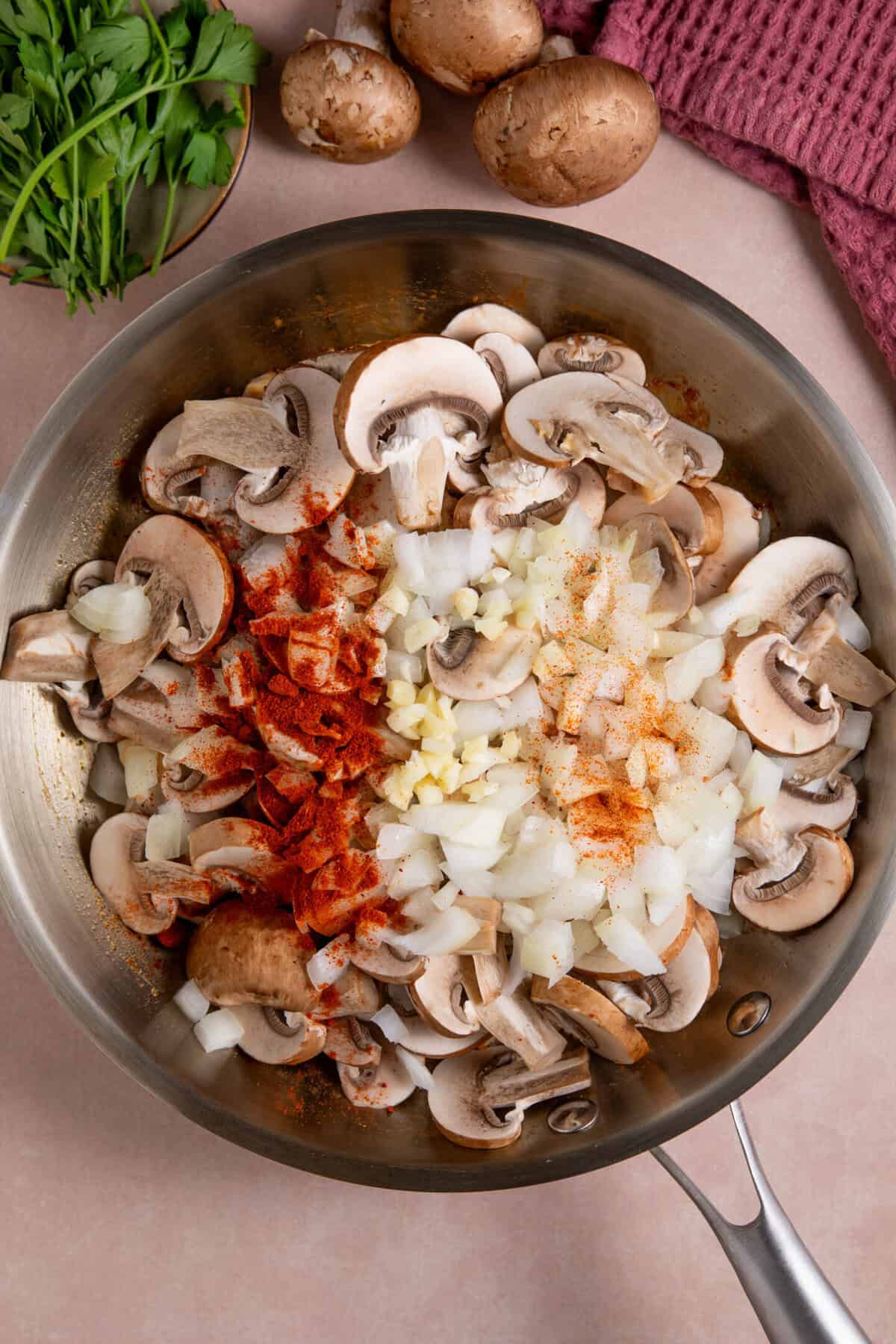 Process shot for gluten free chicken stroganoff showing the ingredients in a pan.