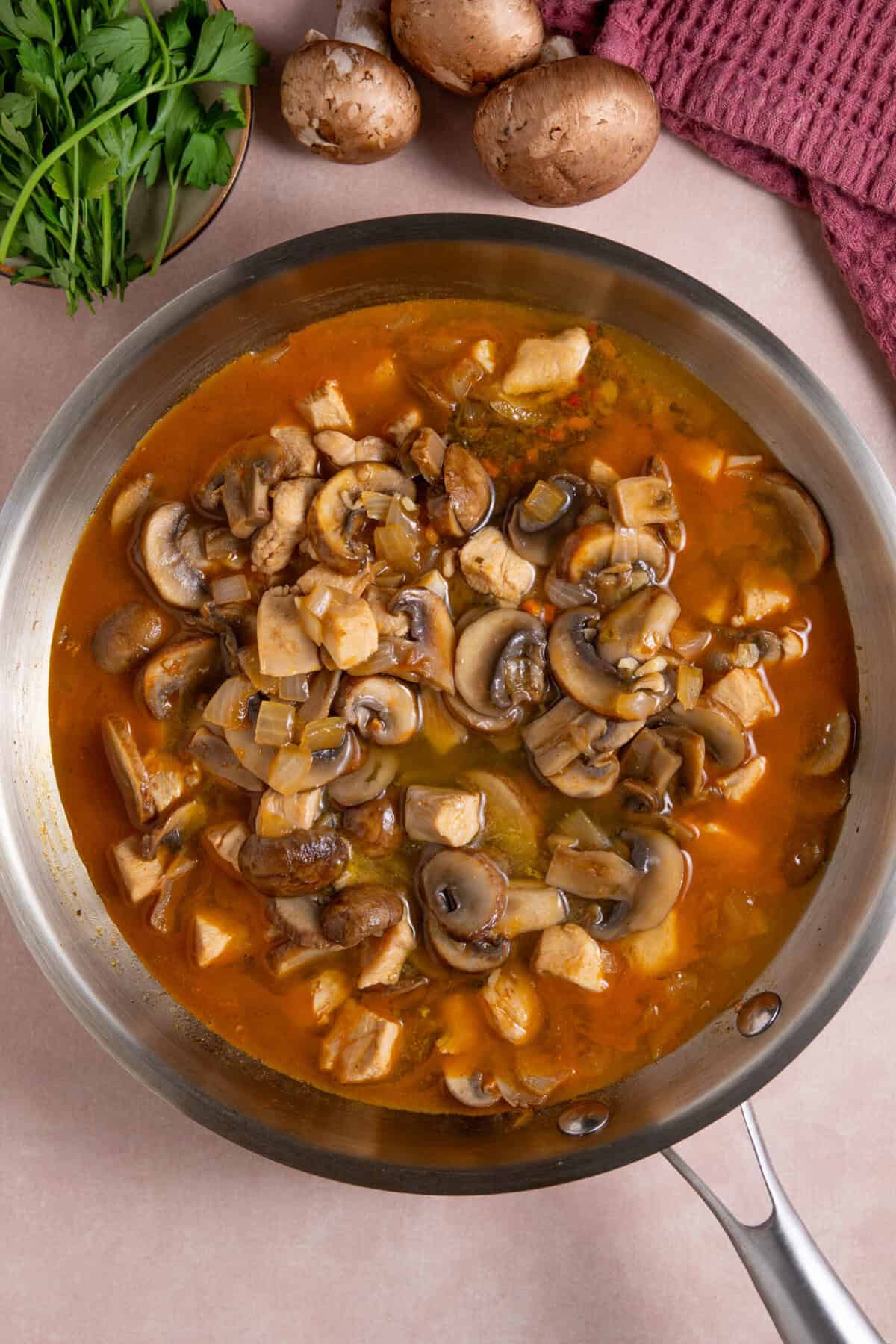 Process shot for gluten free chicken stroganoff showing the stroganoff before adding the cream.