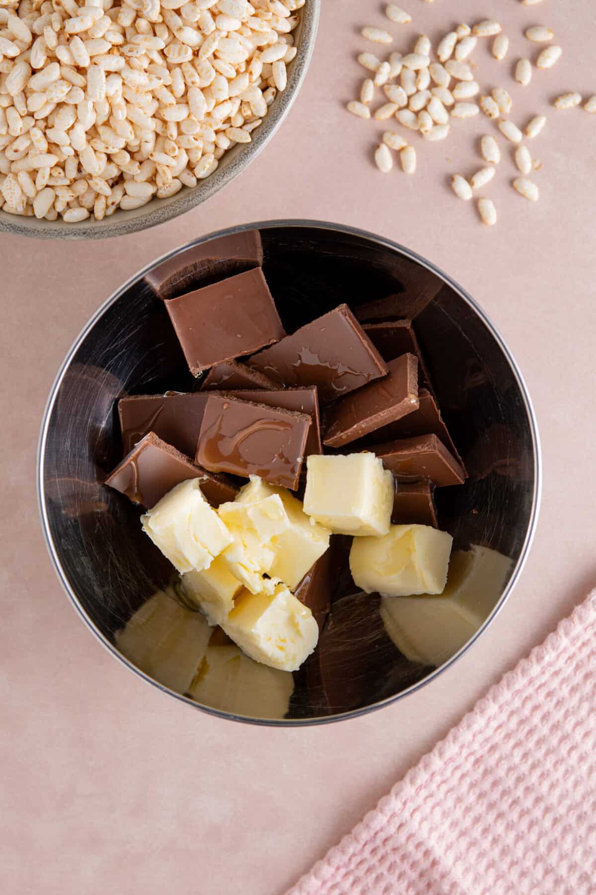 A saucepan with chocolate, butter and syrup in.