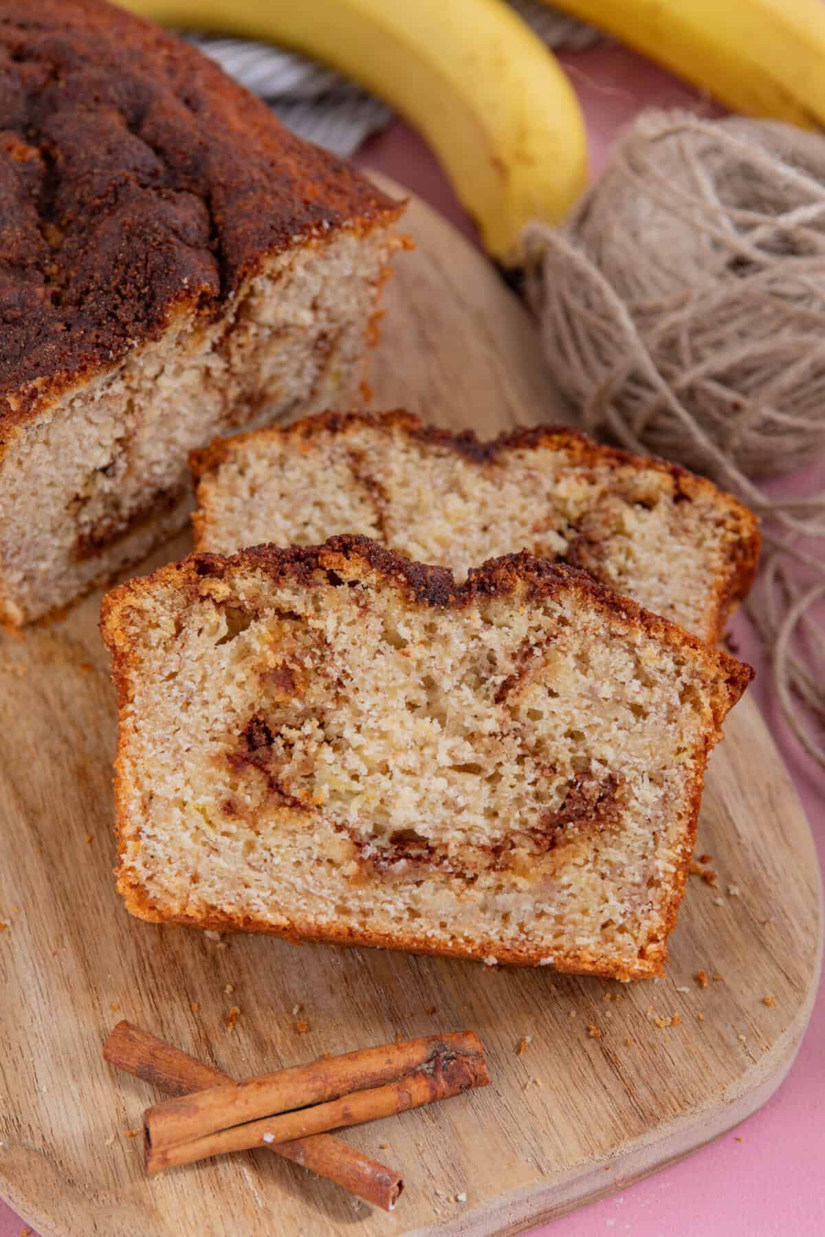 Slices of cinnamon swirl banana bread on a board,