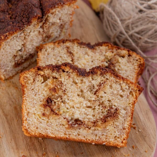 Slices of cinnamon swirl banana bread on a board,