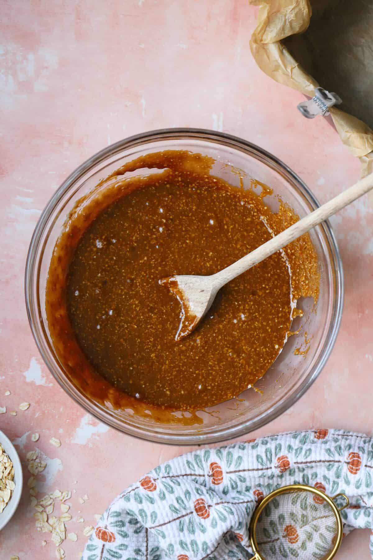 Process shot for gluten free parkin recipe showing the melted buttrer and sugars mixed into the flours.