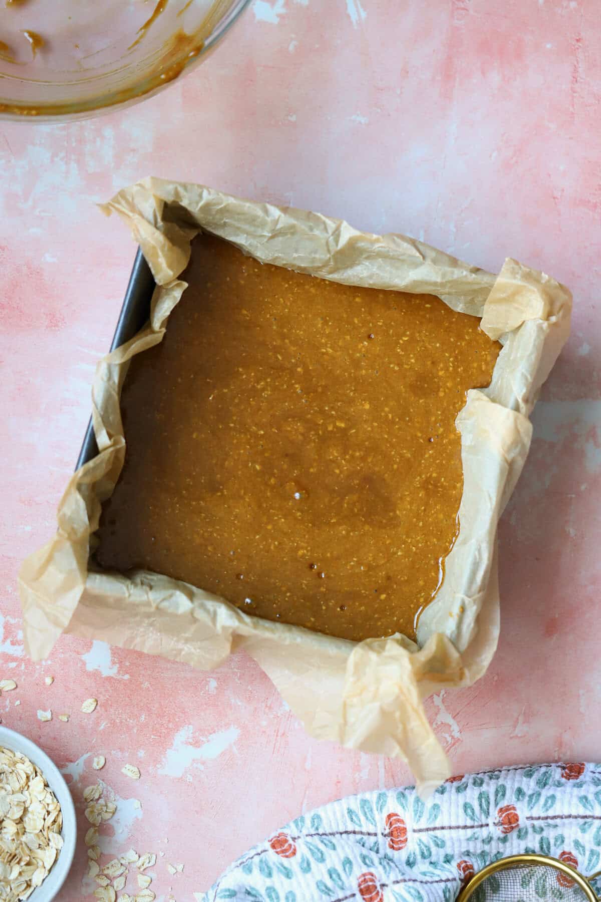 Process shot for gluten free parkin recipe showing the batter in a baking tin before baking.