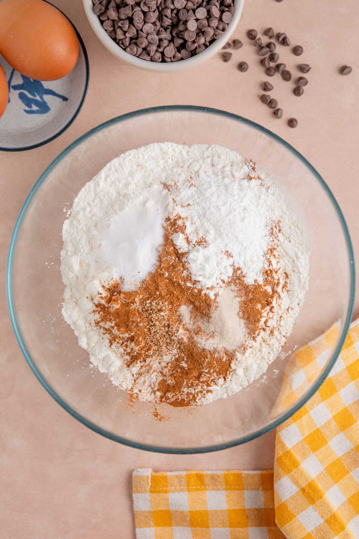 Process shot for gluten free pumpkin chocolate chip muffins showing the dry ingredients in a bowl.