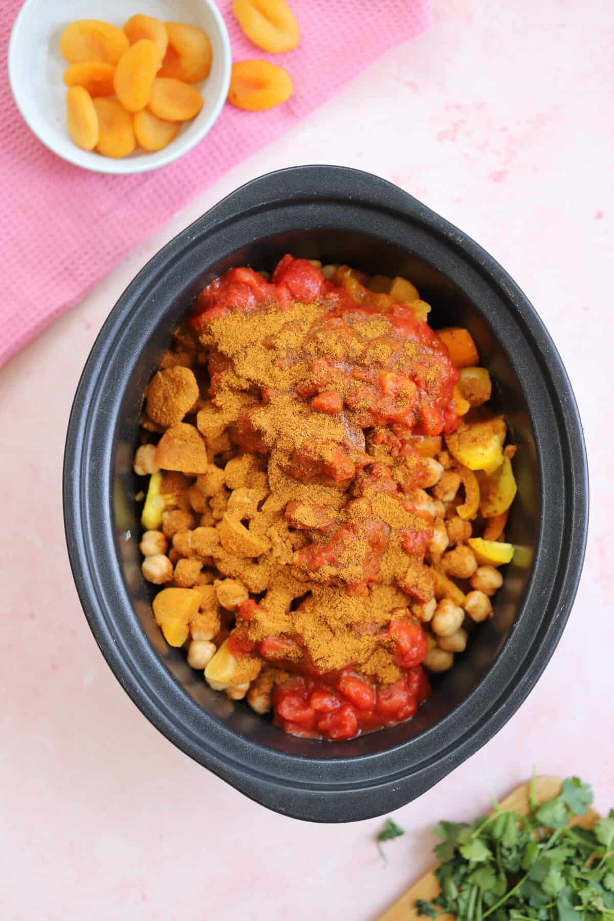 Process shot for slow cooker chicken tagine showing everything added to the slow cooker.