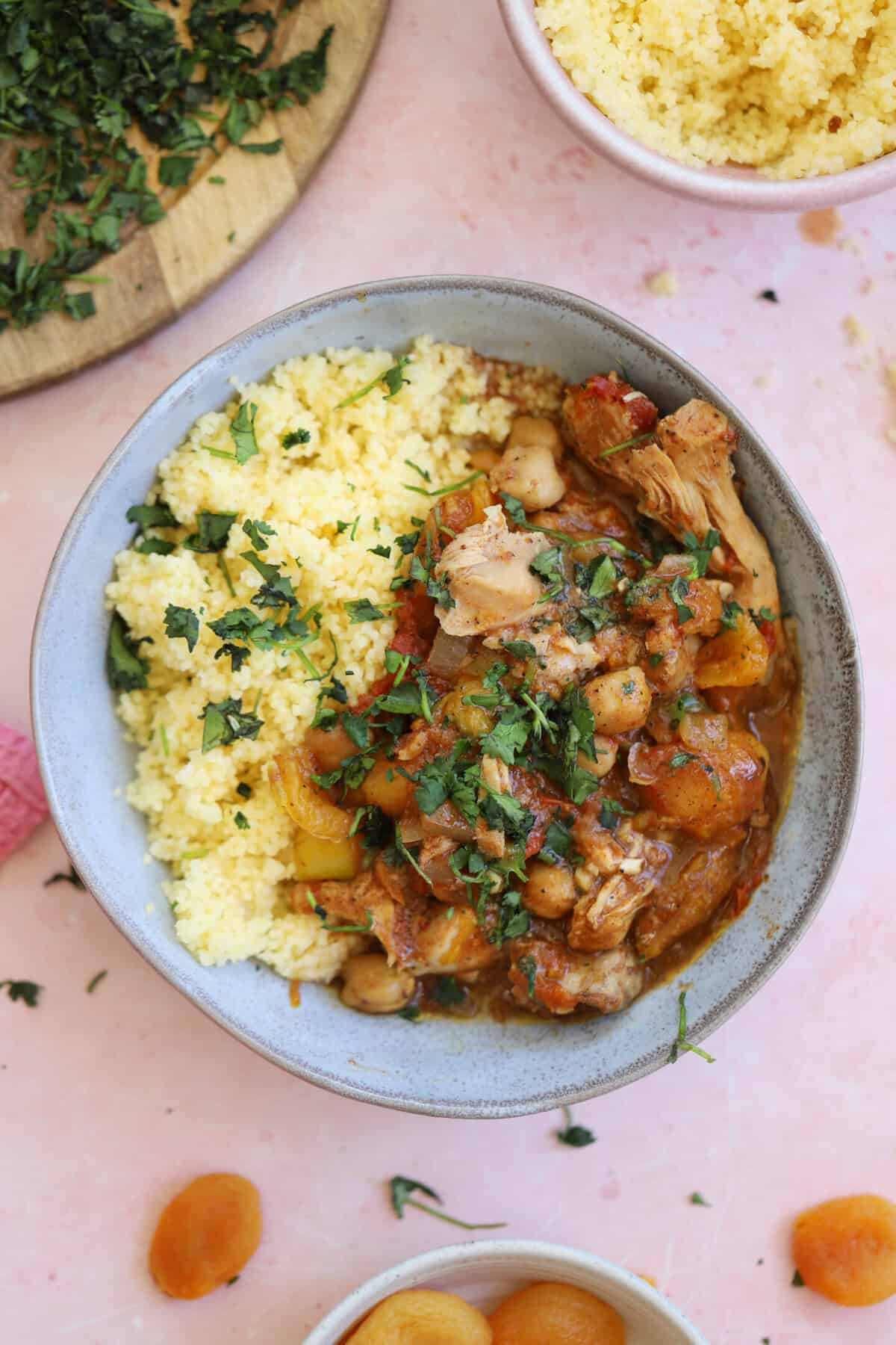 A bowl of slow cooker chicken tagine with gluten free couscous.